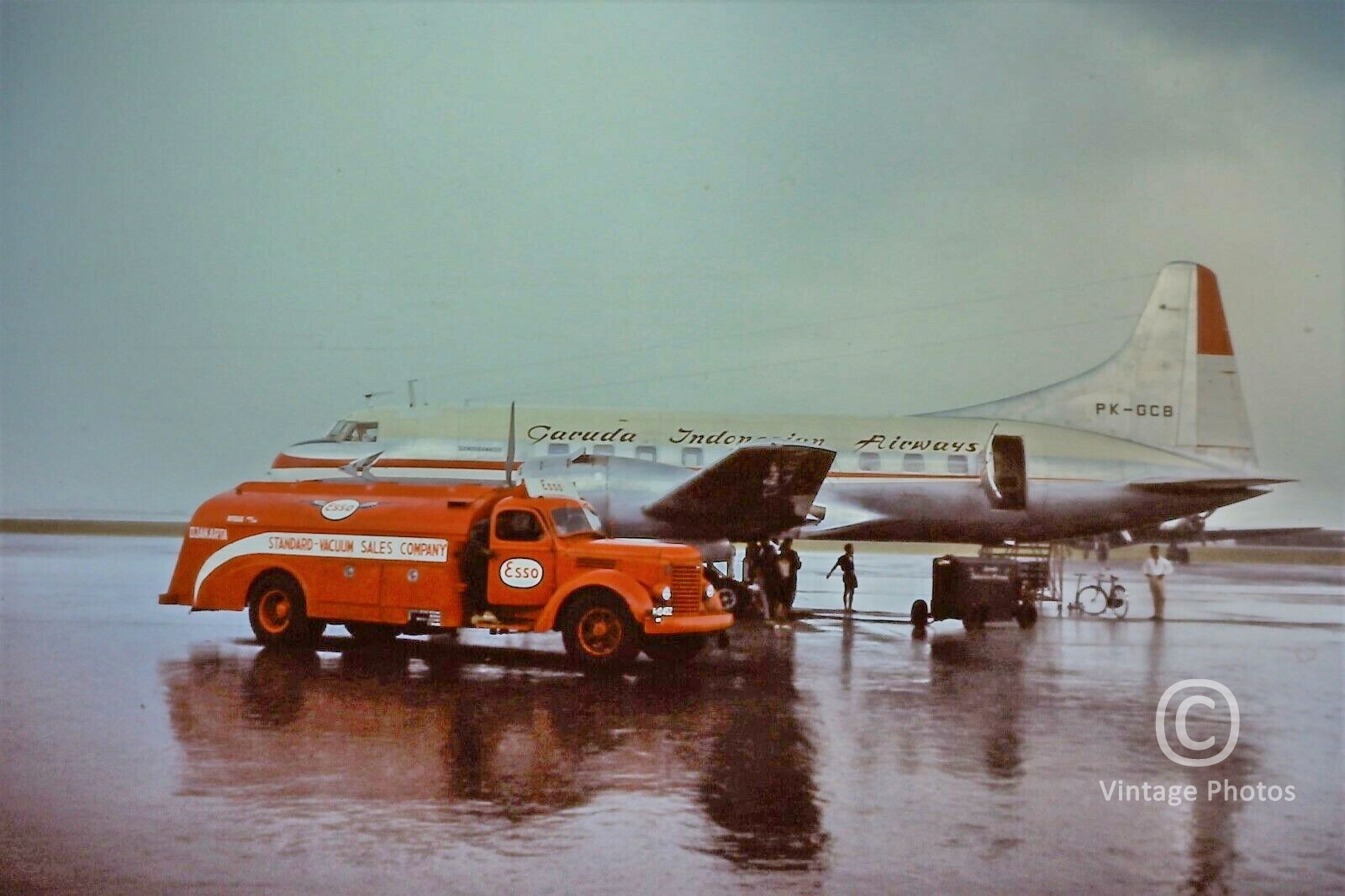 1950s Garuda Indonesian Airways - Convair refueling with ESSO Fuel Truck